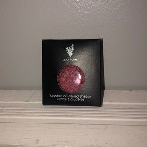 Younique presses eyeshadow in color ostentatious